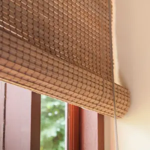 Bamboo Window Blind installed on yellow window frame.
